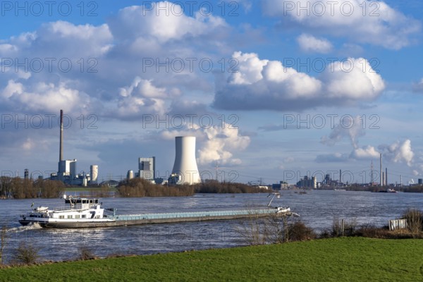 Cargo ships on the Rhine at Rheinberg, in the background the STEAG coal-fired power plant Duisburg Walsum, on the right Thyssenkrupp Steel steelworks, flood, North Rhine-Westphalia, Germany, Europe