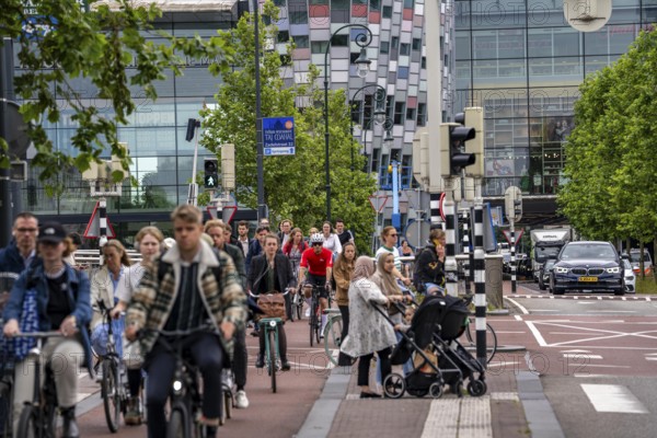 Central cycle path on the Vredenburgviaduct, at the Hoog Catharijne shopping centre, behind Utrecht Centraal station, in the city centre of Utrecht, heavy traffic, Netherlands