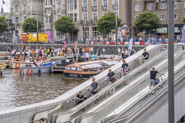 New bicycle car park at Amsterdam Central Station, Stationsplein, space for around 7000 bicycles, largest in Amsterdam, digitally monitored, underground, direct connection to the station and metro, Netherlands, escalators lead to the bicycle garage, Netherlands