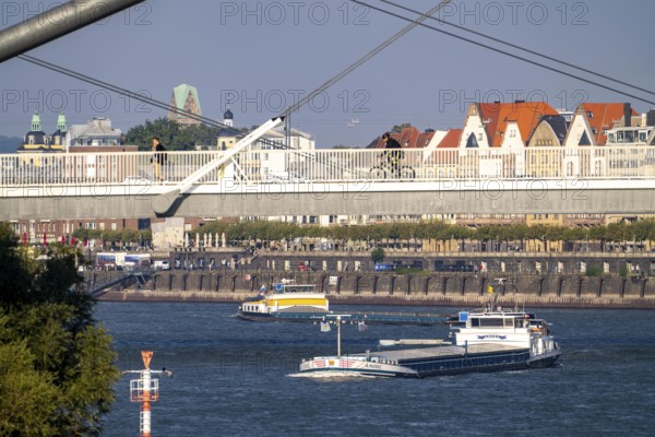 Cargo ships on the Rhine near Düsseldorf, bridge over the Media Harbour, Oberkassler Rhine Bridge, Old Town embankment, Dreischeibenhaus, North Rhine-Westphalia, Germany, Europe