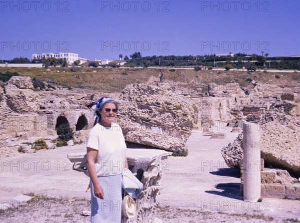 Tourist exploring a Roman archaeological site in Tunisia, 1967