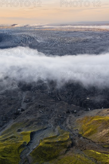 Fog, clouds moving around, glacier ice of the Kötlujökull glacier tongue at sunset, Myrdalsjökull glacier, Pakgil, Iceland, Europe