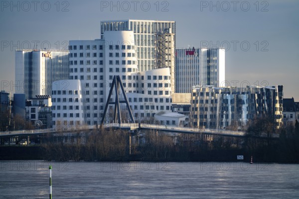 Buildings in Düsseldorf Media Harbour, Gehry buildings, Neuer Zollhof and behind it RWI office building, Rhine, North Rhine-Westphalia, Germany, Europe