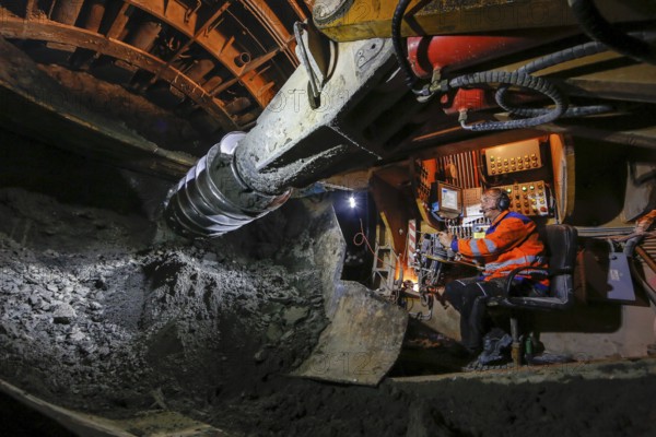 Theme photo Emscher conversion, the Emscher system will be wastewater-free in 2021 - new construction of a sewer on the Boye, the second largest tributary of the Emscher, a machine operator in the tunnelling machine digs the tunnel for the DN 3500 concrete wastewater pipes, the Boye is renaturalised and transformed into a near-natural body of water, was previously an open, above-ground wastewater sewer, mixed sewer with surface water and wastewater, the ecological conversion of the Emscher system consists of the construction of a central wastewater treatment system in the Ruhr area, the construction of sewers and the renaturalisation of the Emscher and its tributaries, archive photo from 13.11.2014, Bottrop, Ruhr area, North Rhine-Westphalia, Germany - -