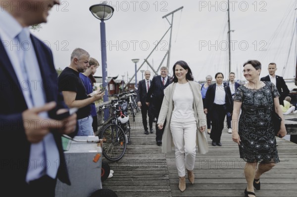 (L-R) Annalena Bärbock (Alliance 90/The Greens), Federal Foreign Minister, and Monika Heinold, Deputy Prime Minister and Finance Minister of Schleswig-Holstein, pictured during the trip to Germany in Flensburg, 25 July 2024. /