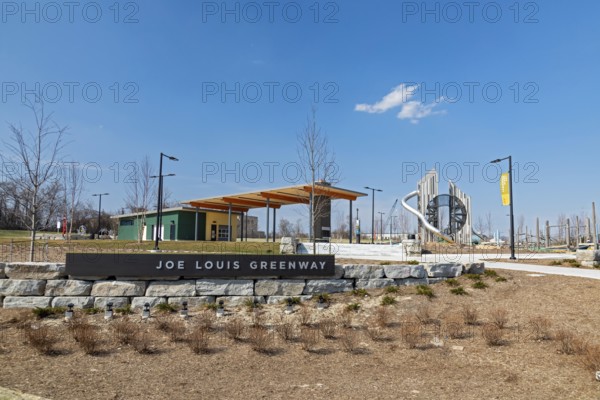 Detroit, Michigan, An entrance to the Joe Louis Greenway. When complete, the Greenway will be a 27.5-mile bicycle/walking trail that will circle much of the city and parts of Highland Park, Hamtramck, and Dearborn. This section was formerly a railway. A children's playground is at right