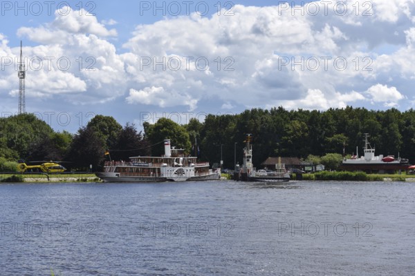 Rescue helicopter near paddle steamer Freya in the Kiel Canal, Kiel Canal, Schleswig-Holstein, Germany, Europe