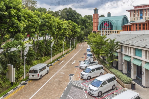 Empty street of Singapore with white cars