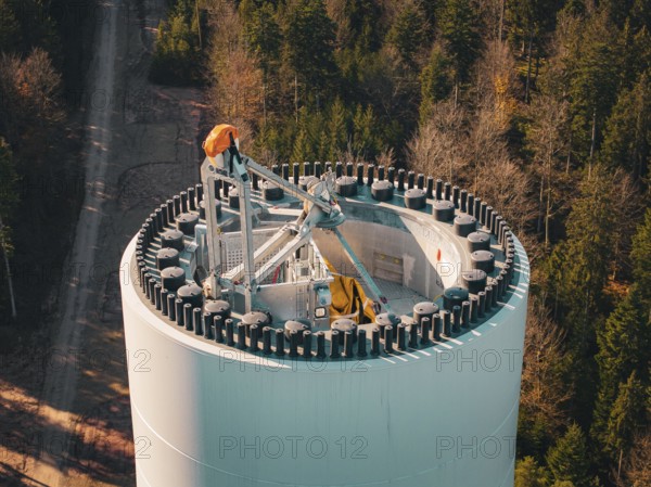 Detailed view of a wind turbine high above an autumnal forest, wind turbine construction, Calmbach, Black Forest, Germany, Europe