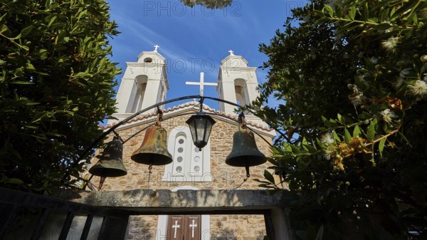 Three church bells in front of a stone wall under a deep blue sky, Koroni, Byzantine fortress, nunnery, Peloponnese, Greece, Europe