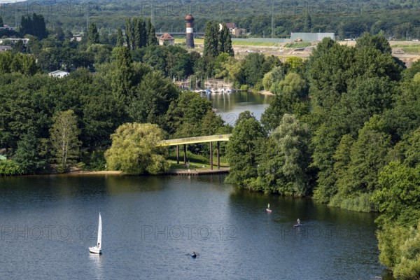 The Sechs-Seen-Platte, a local recreation area in the south of Duisburg, near the Wedau district, 6 former gravel pits, view over the Wolfssee, yellow bridge, behind it the Masurensee and the former railway area, construction site for the 6 Seen Wedau project, North Rhine-Westphalia, Germany, Europe