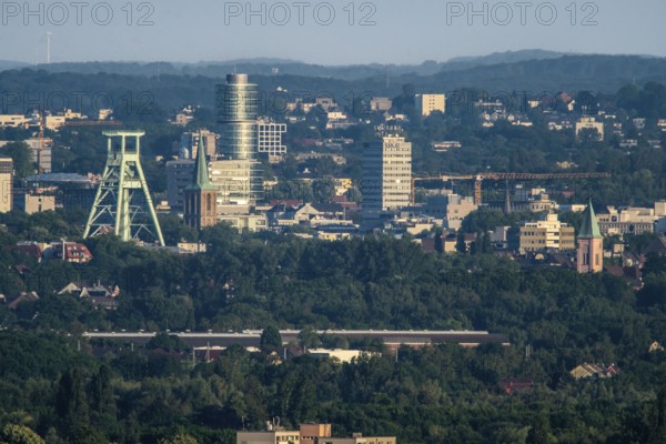 View over the central Ruhr area, from north to southeast, on the skyline of the city centre of Bochum, with the mining museum, energy supply, power lines, North Rhine-Westphalia, Germany, Europe