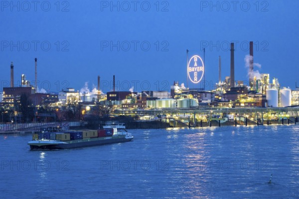 Backdrop of Chempark Leverkusen, Bayer Leverkusen, chemical park, chemical plant, river Rhine, cargo ship, Leverkusen, North Rhine-Westphalia, Germany, Europe