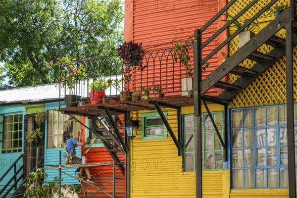 La Boca, Buenos Aires, Argentina, colourfully painted houses in the harbour district around the El Caminito alley. La Boca emerged at the end of the 19th century as a neighbourhood of Italian immigrants, most of whom worked as industrial workers. Today, the working-class neighbourhood is popular with tourists, partly because of its original houses, often built from the sheet metal of scrapped ships and brightly painted with ship paint. Many artists advertise their works on the pavements of El Caminito alleyway, South America