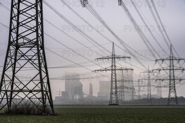 Large power line, 380 KV extra-high voltage lines, near Rommerskirchen, RWE lignite-fired power station Niederaußem in the fog, North Rhine-Westphalia, Germany, Europe