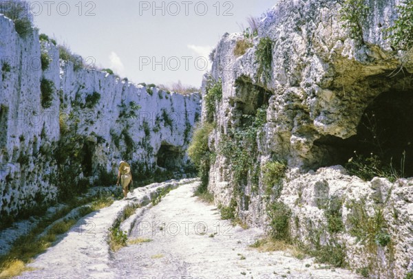 Rock cut tombs behind the theatre, fifth century BC, Greek Theatre at Syracuse, Sicily, Italy, Europe 1969, Europe