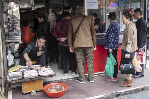 Stall selling duck giblets, including dried duck blood, an inexpensive foodstuff that is very important as a base for many soups, 378 Lane Market, Nanjing, China, Asia