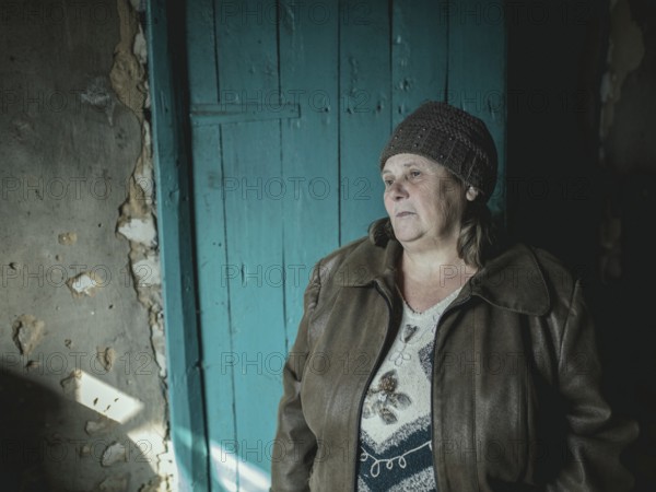 Larisa in her house in Borshchivka. The village was under Russian occupation. She hid with her granddaughter Angelina for almost six months in her house in Borshchivka, Raion Isyum, Kharkiv Oblast, Ukraine, Europe