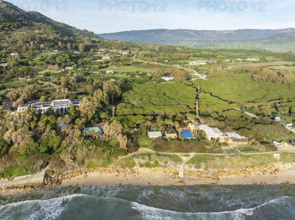 Atlantic Ocean coastline, Hurricane Hotel and the hinterland near Tarifa. Aerial view. Drone shot. Cádiz province, Andalusia, Spain, Europe