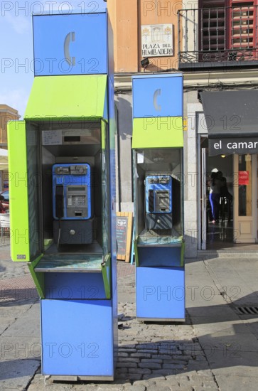 Telephone kiosk boxes in street, La Latina, Madrid city centre, Spain, Europe