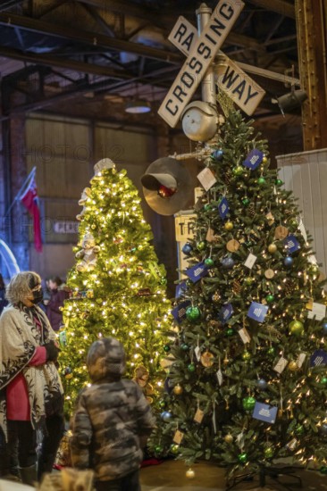 St. Thomas, Ontario Canada - Decorated Christmas trees and railway crossing are on display at the Elgin County Railway Museum.