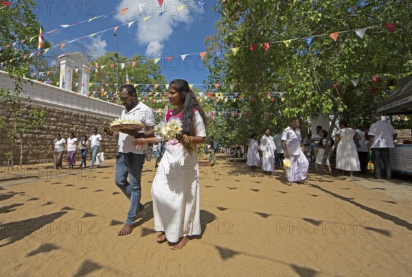 Sri Lankan pilgrims in the holy city of Anuradhapura, North Central Province, Sri Lanka, Asia