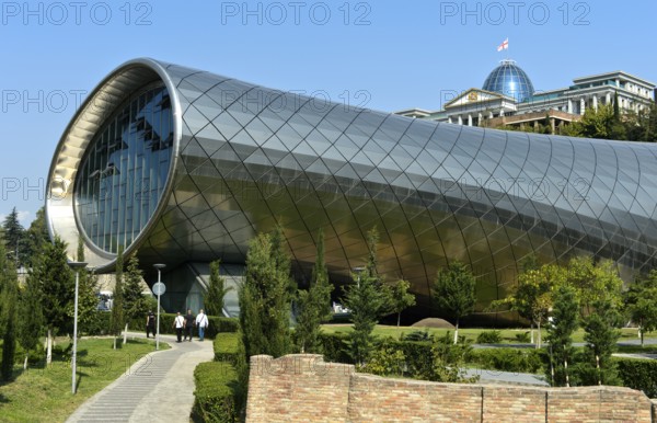 Futuristic theatre building and exhibition hall in Rike City Park, architect Studio Fuksas, behind the Palace of Georgia, formerly the Presidential Palace, Tbilisi, Georgia, Asia