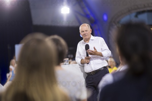 Olaf Scholz (Chancellor of the Federal Republic of Germany, SPD) surrounded by guests at the Chancellor's meeting at ufaFabrik in Berlin on 4 September 2024