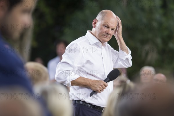 Olaf Scholz (Chancellor of the Federal Republic of Germany, SPD) surrounded by guests at the Chancellor's meeting at ufaFabrik in Berlin on 4 September 2024