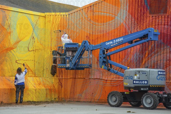 American street artist Douglas Hoekzema, also known as HOXXOH paints a wall in Ystad, Skåne County, Sweden, Scandinavia, Europe