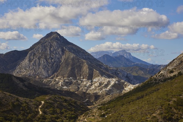 Mountain landscape with rocky peaks under a slightly cloudy sky, surrounded by green valley, Colourful mountain village, Morning light, Olymbos, Karpathos, Dodecanese, Greek Islands, Greece, Europe