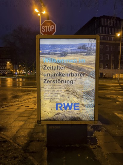 Alleged advertising poster of the energy company RWE, which professes the environmental destruction caused by lignite mining, presumably placed by environmental activists, Essen, North Rhine-Westphalia, Germany, Europe