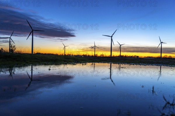 Wind farm near Holzweiler, town of Erkelenz, wind turbines, rain puddle, North Rhine-Westphalia, Germany, Europe