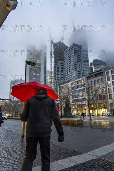 Rainy weather, freezing rain, Goetheplatz, high-rise skyline in clouds, passers-by hurrying through the damp, icy weather, Frankfurt am Main, Hesse, Germany, Europe