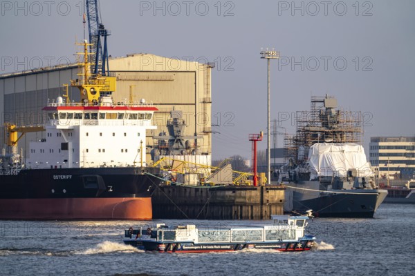 Port of Hamburg, Blohm + Voss shipyard, dredger OSTERIFF and corvette of the German Navy, Karlsruhe, F267, under construction, harbour tour launch, Hamburg, Germany, Europe