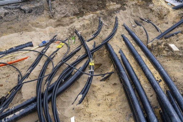 Supply lines, laid underground, exposed during a construction project, Bochum, North Rhine-Westphalia, Germany, Europe