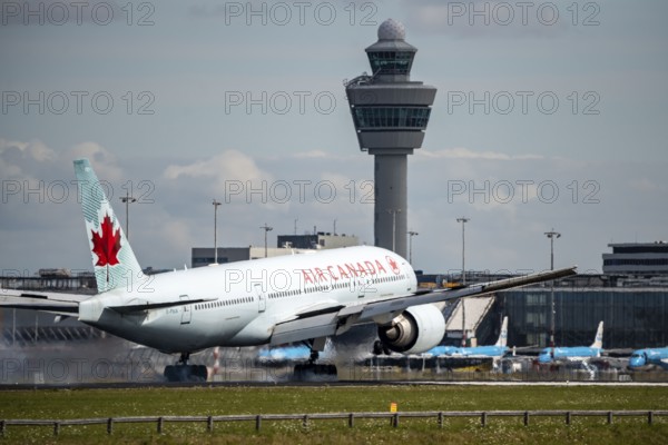 Amsterdam Shiphol Airport, AMS, aircraft approaching Kaagbaan, runway, terminal building, air traffic control tower, C-FIUA, Air Canada Boeing 777-200Schiphol