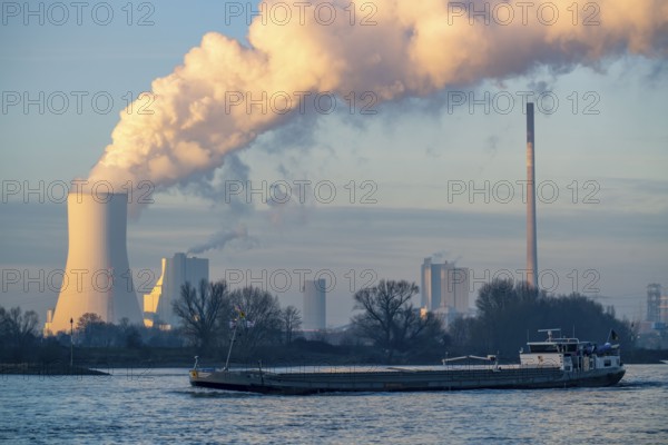 Cooling tower of the coal-fired power plant Duisburg-Walsum, operated by STEAG and EVN AG, 181 metres high, power plant unit 10, water vapour cloud, container cargo ship on the Rhine, Duisburg, North Rhine-Westphalia, Germany, Europe