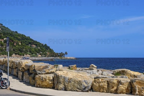 Long pier and coastline of the Riviera di Ponente with a view of the Ligurian Sea in the Oneglia district of Imperia, Liguria, Italy, Europe