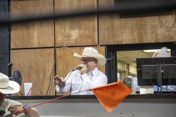 Oklahoma City, Oklahoma, The auctioneer at the Oklahoma National Stockyards. Since it was founded in 1910, more than 100 million cattle have been sold at ONSY's weekly auctions