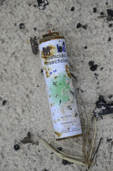 Washed up can of insecticide, Loango National Park, Parc National de Loango, Ogooué-Maritime Province, Gabon, Africa