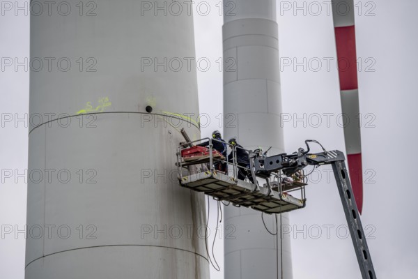 Preparation for the demolition of the tower of a 20 year old wind turbine, in the Werl wind farm, 5 old Enercon E-66 turbines are demolished, 2 new Siemens SG6.6-170 wind turbines replace them, the WTGs produce twice as much energy, 12 MW power, as the 5 old wind turbines, called repowering, Werl, North Rhine-Westphalia, Germany, Europe