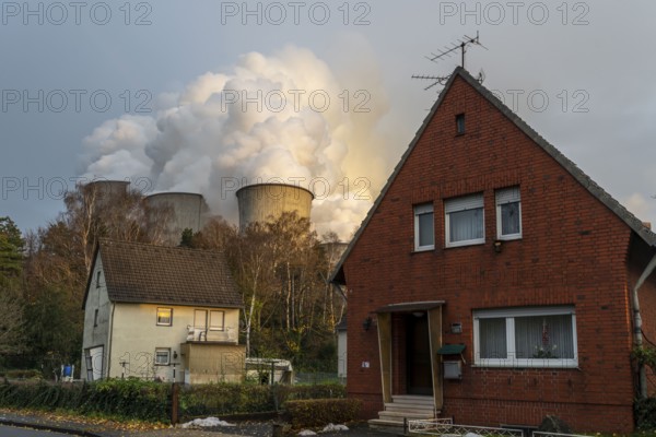 Auenheim village near the lignite-fired power station, RWE Power AG Niederaußem power station, near Bergheim, North Rhine-Westphalia, North Rhine-Westphalia, Germany, Europe