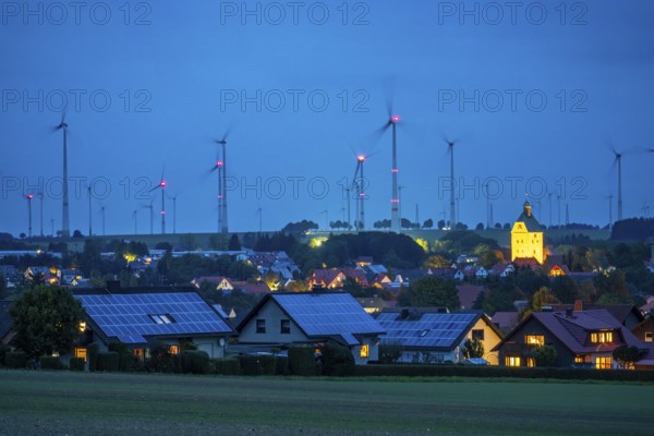 Wind farm above the village of Lichtenau, self-proclaimed energy town, houses with photovoltaic systems on the roofs, Paderborn district, OWL, A North Rhine-Westphalia, Germany, Europe