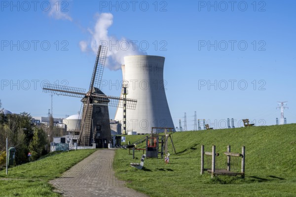 The Doel nuclear power plant on the Scheldt, one of two nuclear power plants in Belgium, consists of three operating units, each with a pressurised water reactor, as well as a decommissioned unit, historic Scheldemolen, windmill on the Scheldt dike, Antwerp, Belgium, Europe