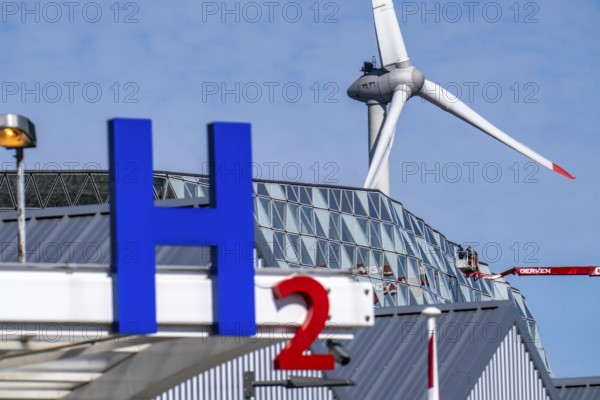 Hydrogen filling station in Antwerp, for cars and lorries, H2 lettering, wind turbine in the harbour, Belgium, Europe