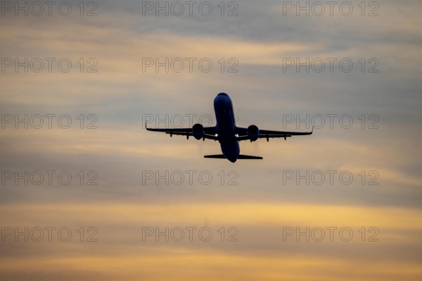 Düsseldorf International Airport, sunset, aircraft taking off from the main runway south, 05R/23L, North Rhine-Westphalia, Germany, Europe