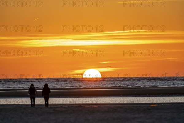 North Sea island of Langeoog, early summer, shortly after the first easing of the lockdown in the Corona crisis, still quite few tourists on the beach, offshore wind farm, sunset, Lower Saxony, Germany, Europe