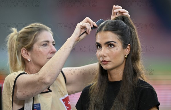 Make-up artist fixes the hair of TV presenter Lea Wagner, portrait, Voith Arena, Heidenheim, Baden-Württemberg, Germany, Europe