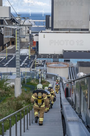 CopenHill, waste incineration plant and artificial ski slope, firefighters under respiratory protection, endurance training, skiing with a view of the ski lift, 90 metres high and 400 metres long slope on artificial turf, Copenhagen, Denmark, Europe